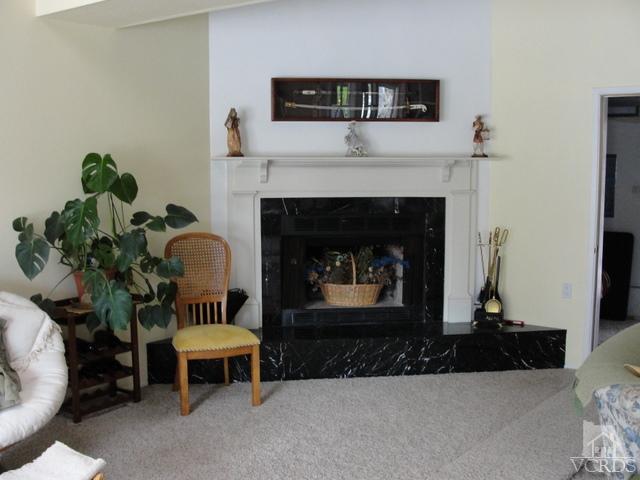 522 Avocado Place Camarillo, CA 93010 - Photo 23 of 30 a living room with furniture and a fireplace