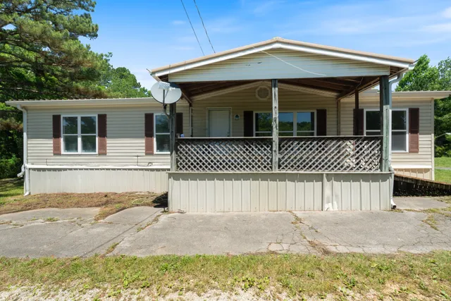 a front view of a house with a garage
