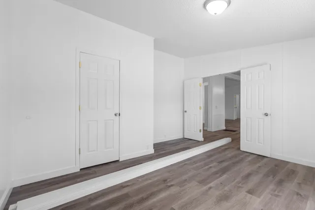 a view of a livingroom with wooden floor