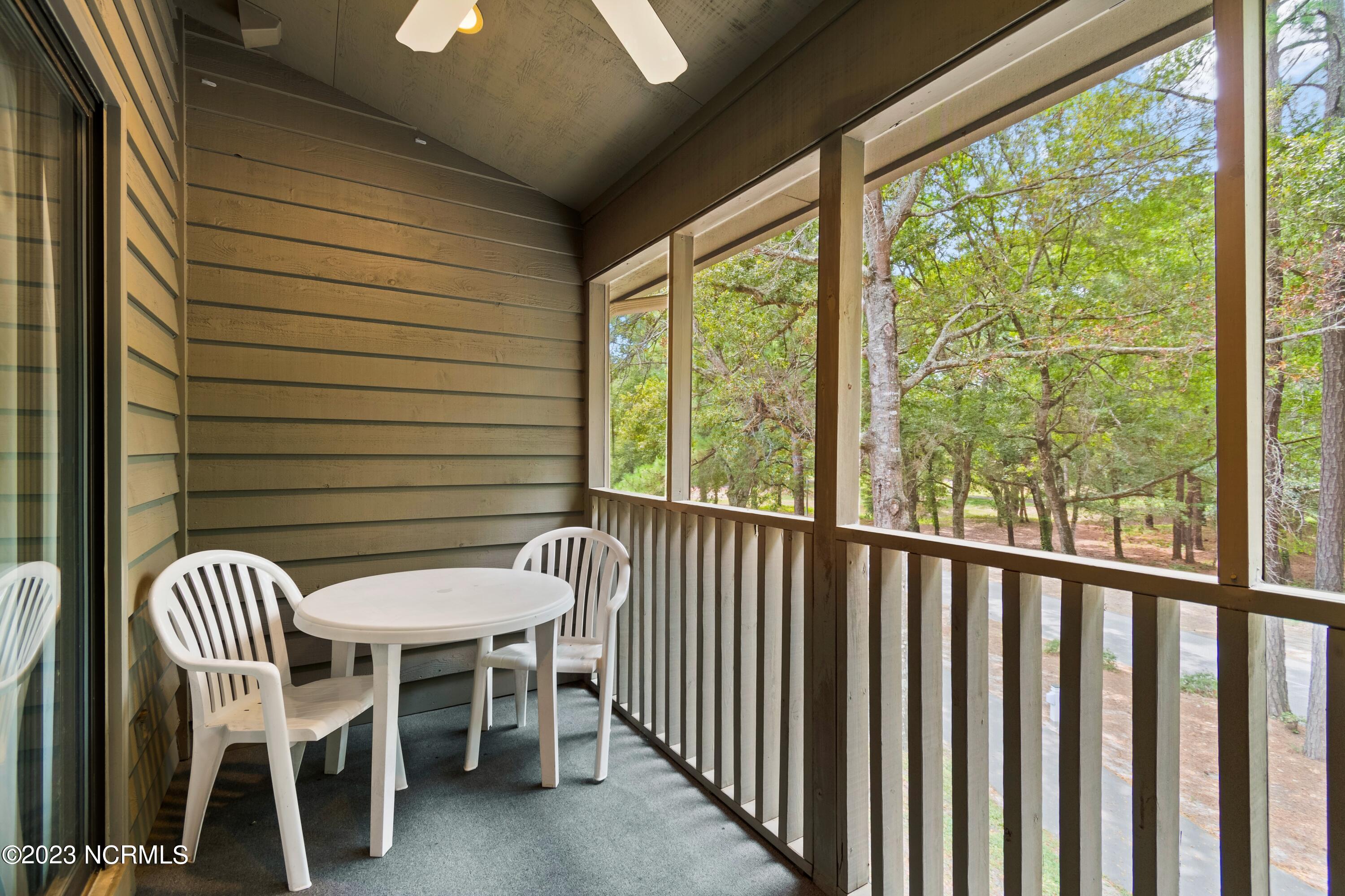 226 Clubhouse Road, Unit 17D Sunset Beach, NC 28468 - Photo 31 of 37 The fireflies will shine bright like diamonds from this top level screened porch area.
