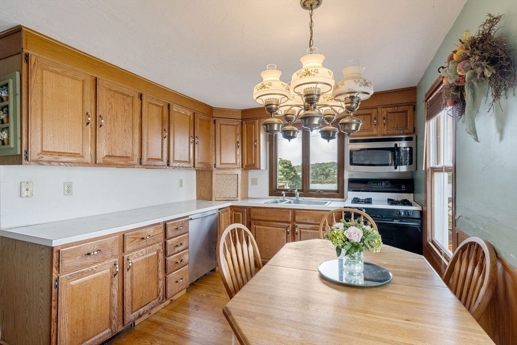 49 Summit Avenue Hull, MA 02045 - Photo 19 of 29 a kitchen with a table and chairs