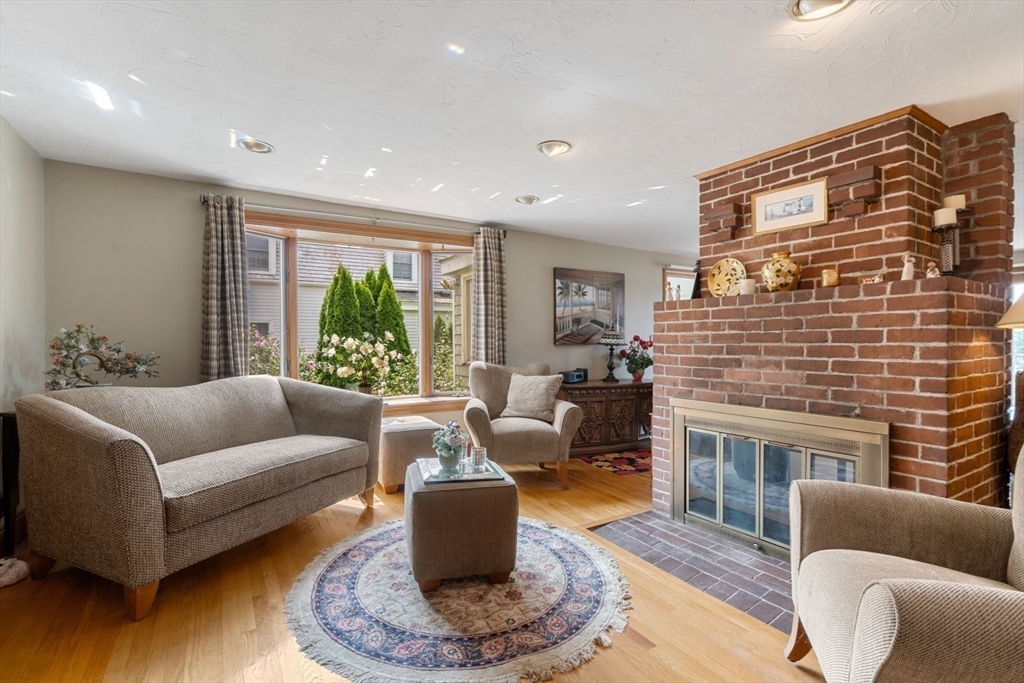 49 Summit Avenue Hull, MA 02045 - Photo 20 of 29 a living room with furniture windows and a fireplace