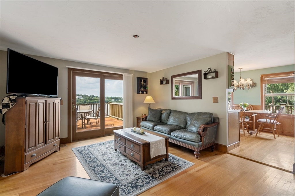 49 Summit Avenue Hull, MA 02045 - Photo 24 of 29 a living room with furniture and a flat screen tv