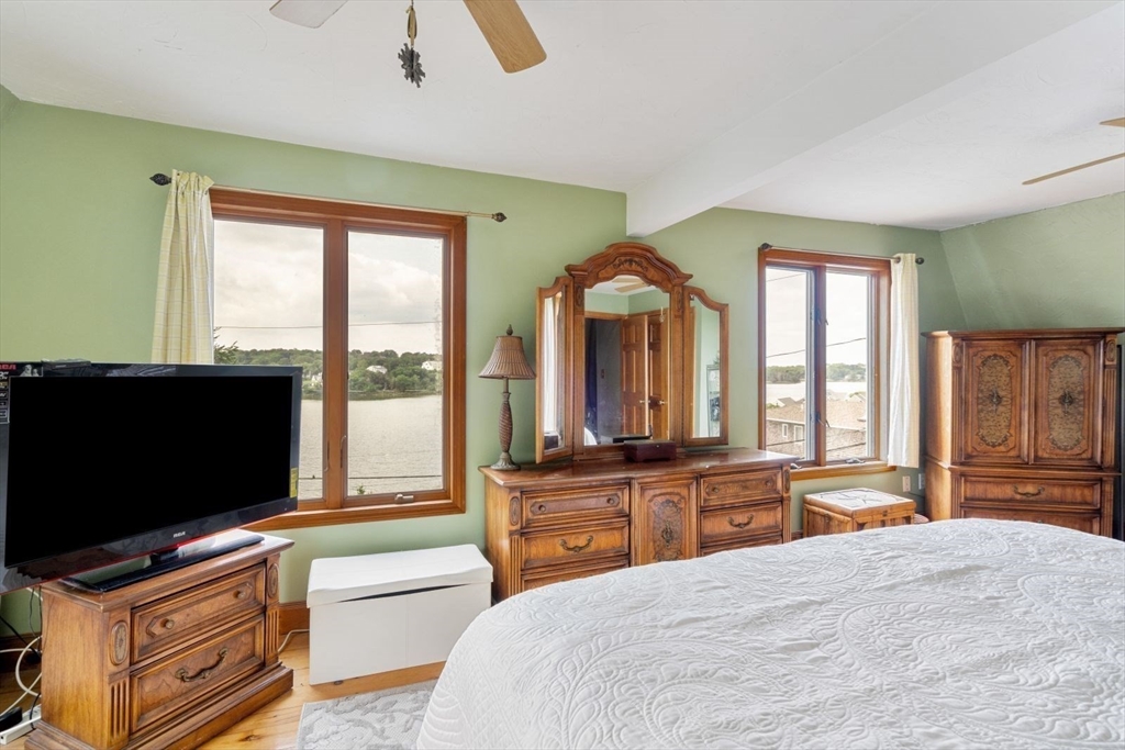 49 Summit Avenue Hull, MA 02045 - Photo 26 of 29 a bedroom with furniture and a flat screen tv