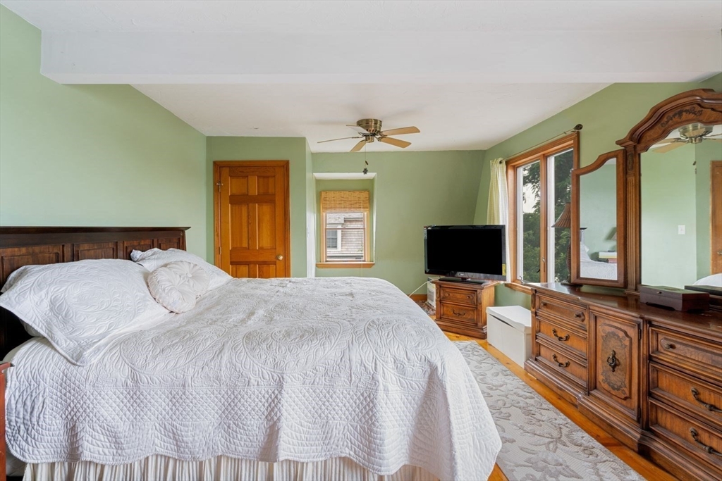 49 Summit Avenue Hull, MA 02045 - Photo 27 of 29 a bedroom with a bed and a flat screen tv