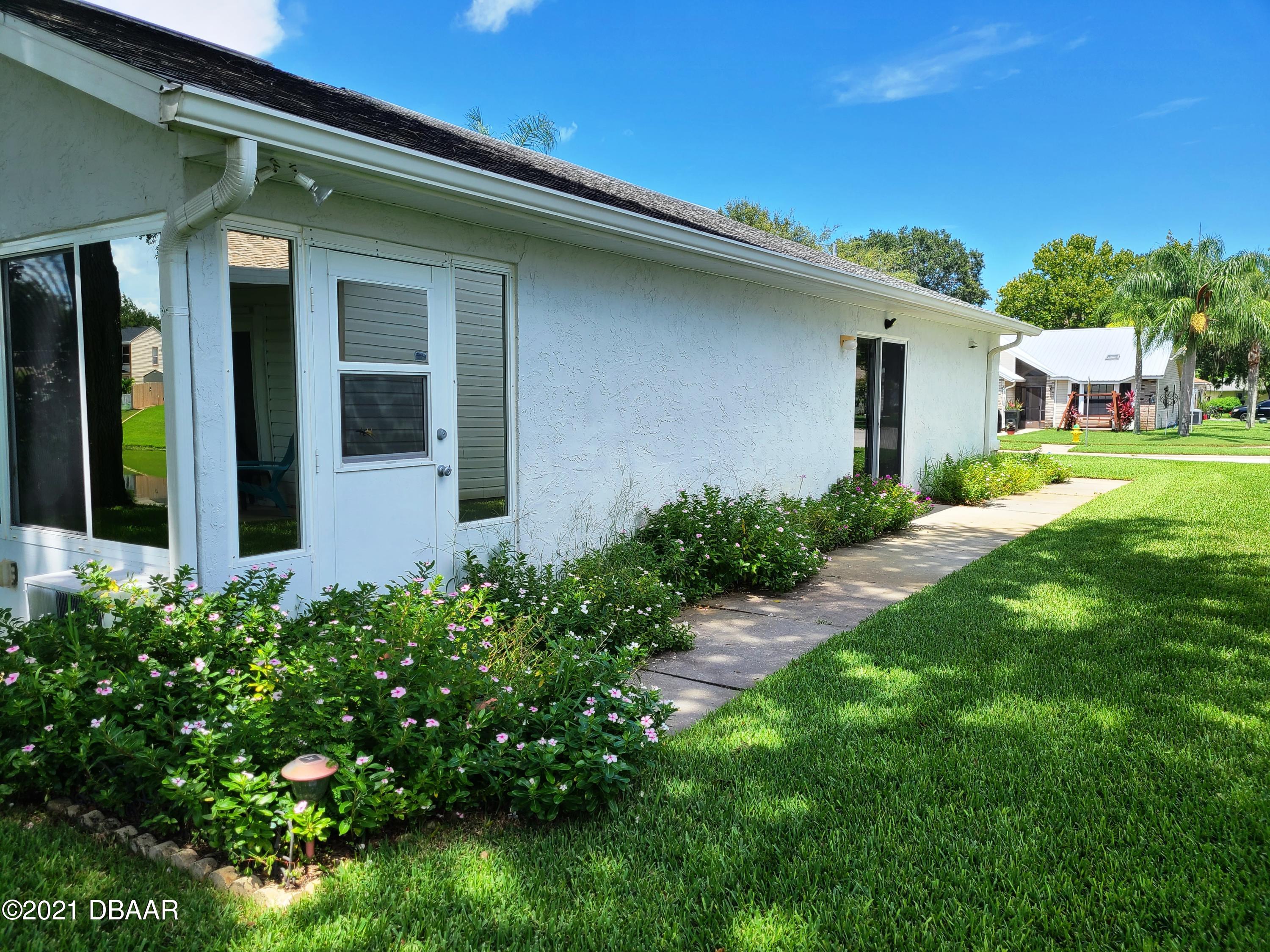980 Deer Springs Road Port Orange, FL 32129 - Photo 21 of 22 980 Deer Spring side sidewalk