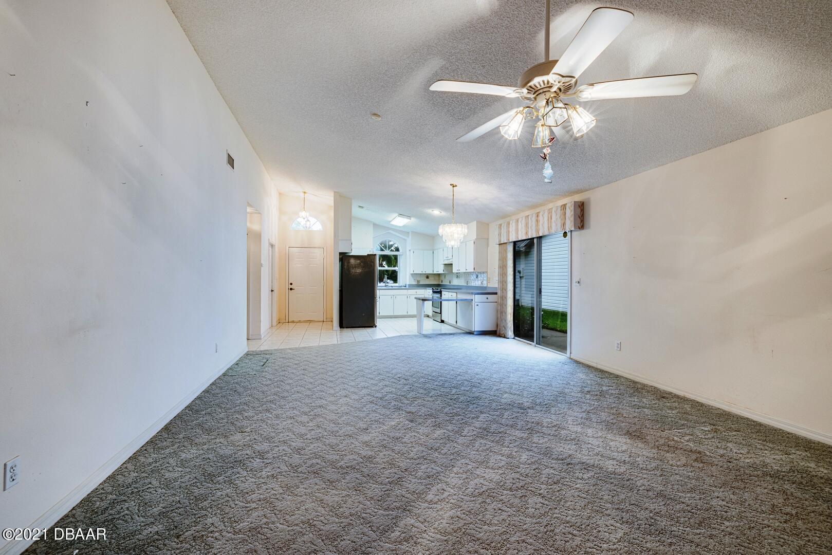 980 Deer Springs Road Port Orange, FL 32129 - Photo 6 of 22 980 DEER SPRINGS ROAD great room to kitc