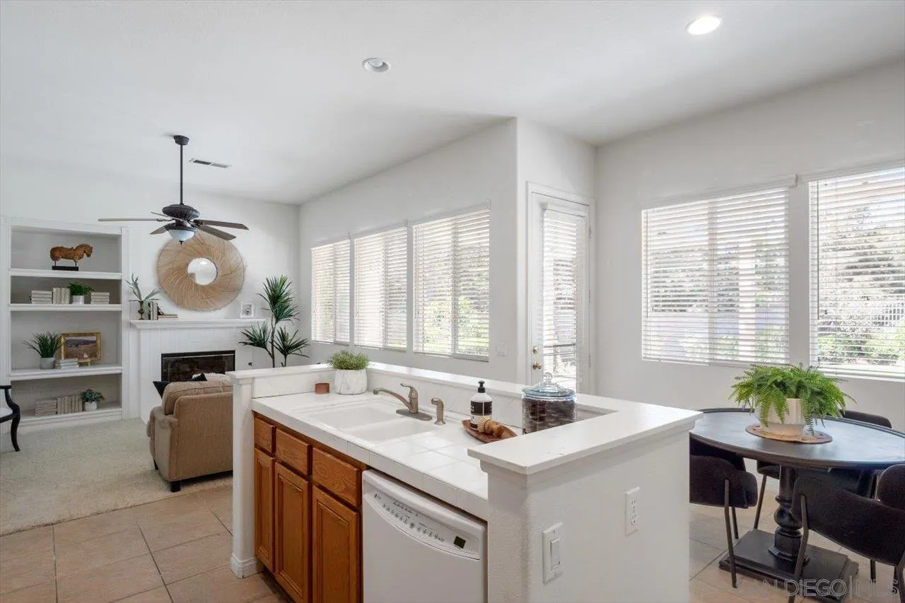 2195 Stone Castle Fallbrook, CA 92028 - Photo 13 of 37 a kitchen with a sink stove and cabinets