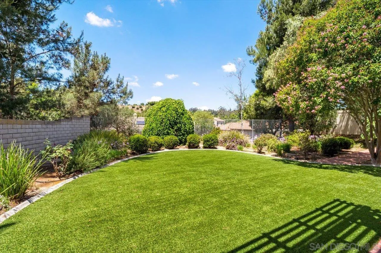 2195 Stone Castle Fallbrook, CA 92028 - Photo 17 of 37 a view of yard with swimming pool and green space