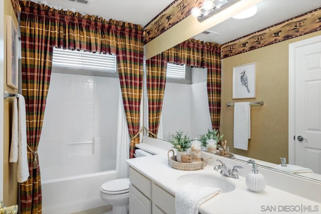2195 Stone Castle Fallbrook, CA 92028 - Photo 20 of 37 a bathroom with a sink toilet and shower