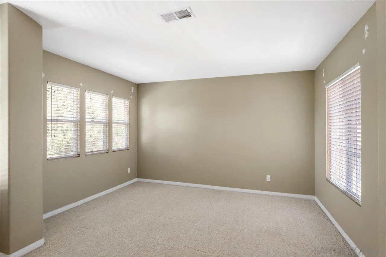 2195 Stone Castle Fallbrook, CA 92028 - Photo 23 of 37 an empty room with windows