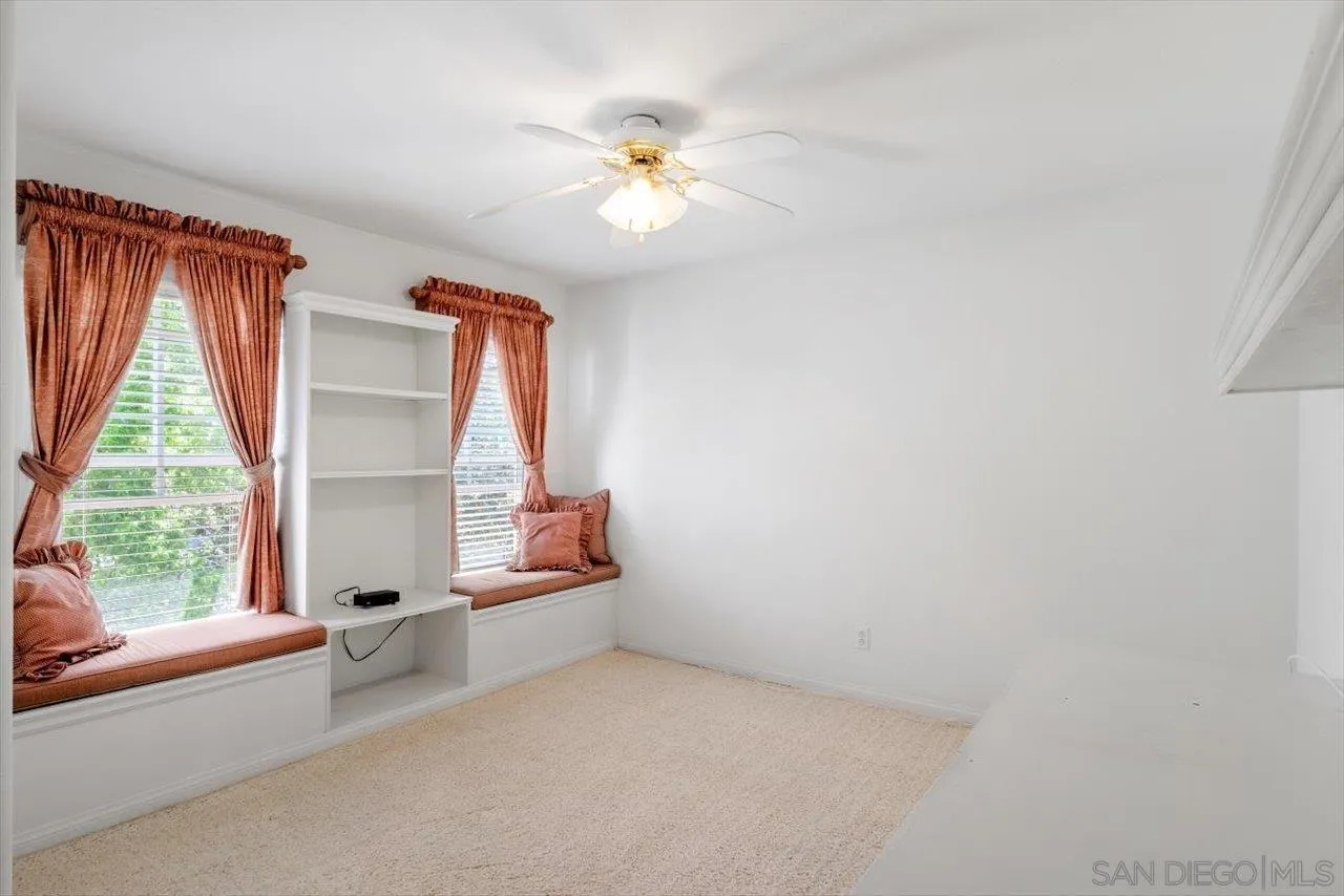 2195 Stone Castle Fallbrook, CA 92028 - Photo 29 of 37 a view of room with a ceiling fan and a window