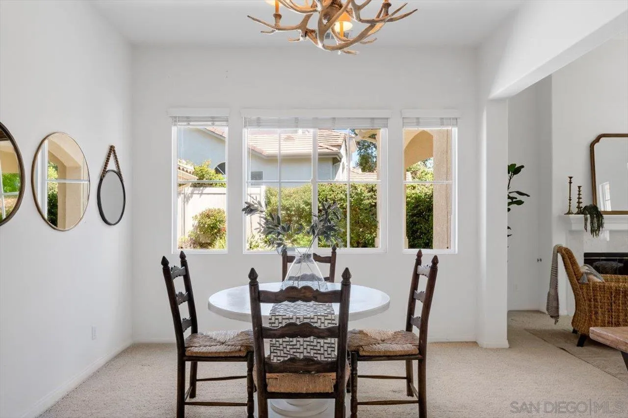 2195 Stone Castle Fallbrook, CA 92028 - Photo 6 of 37 a view of a dining room with furniture window and outside view