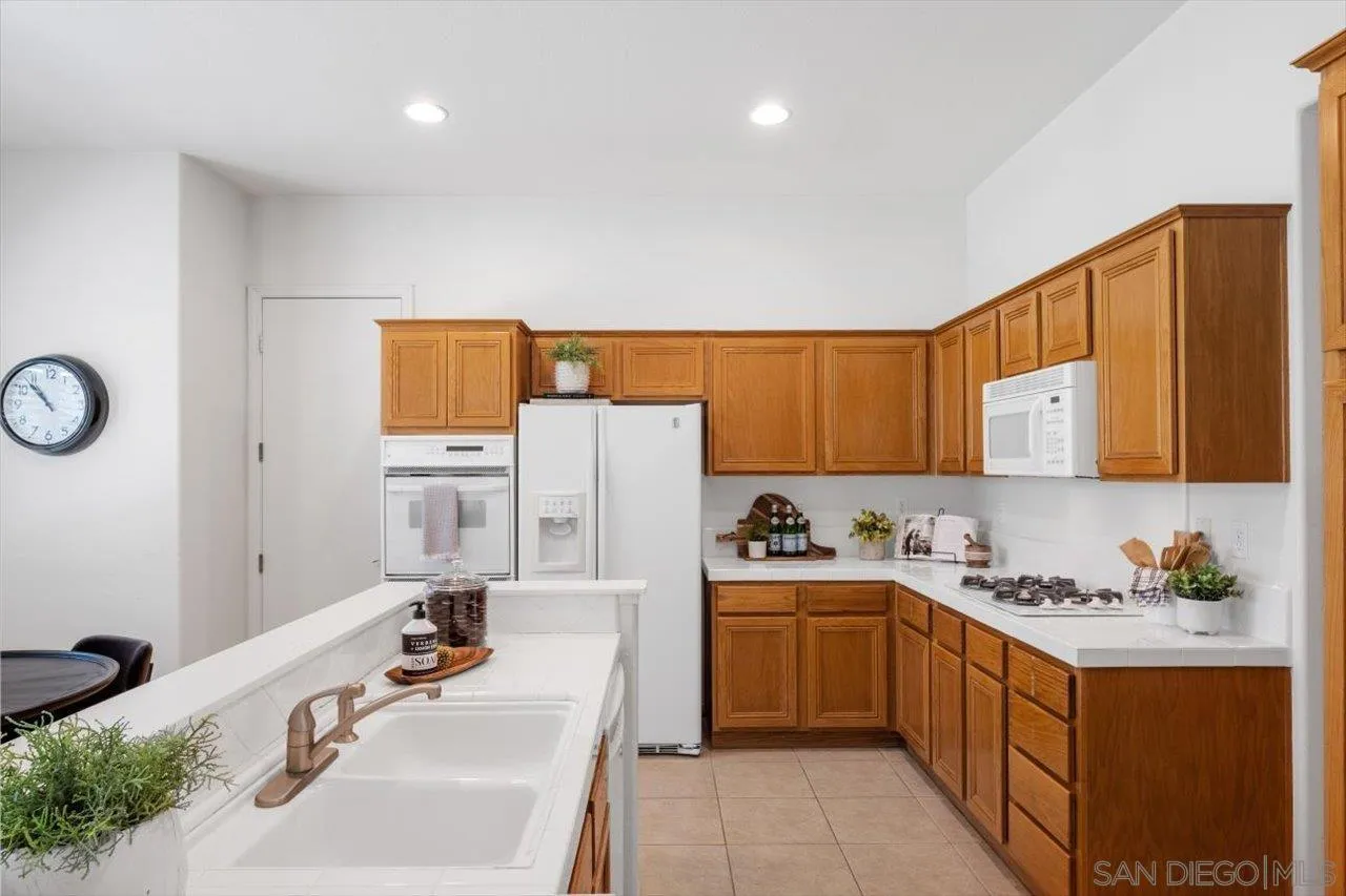 2195 Stone Castle Fallbrook, CA 92028 - Photo 10 of 37 a kitchen with a sink cabinets and window