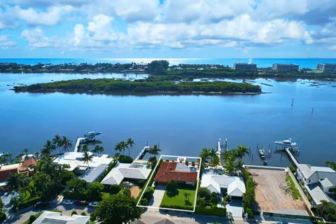 an aerial view of a house with a lake view