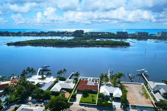 an aerial view of a house with a lake view