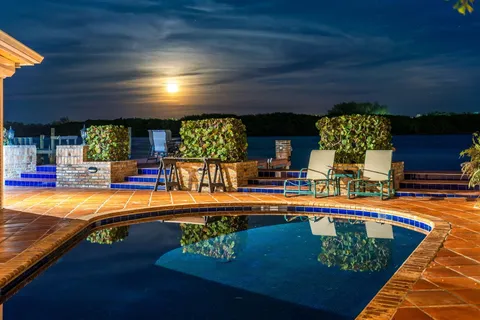 a swimming pool with an outdoor seating