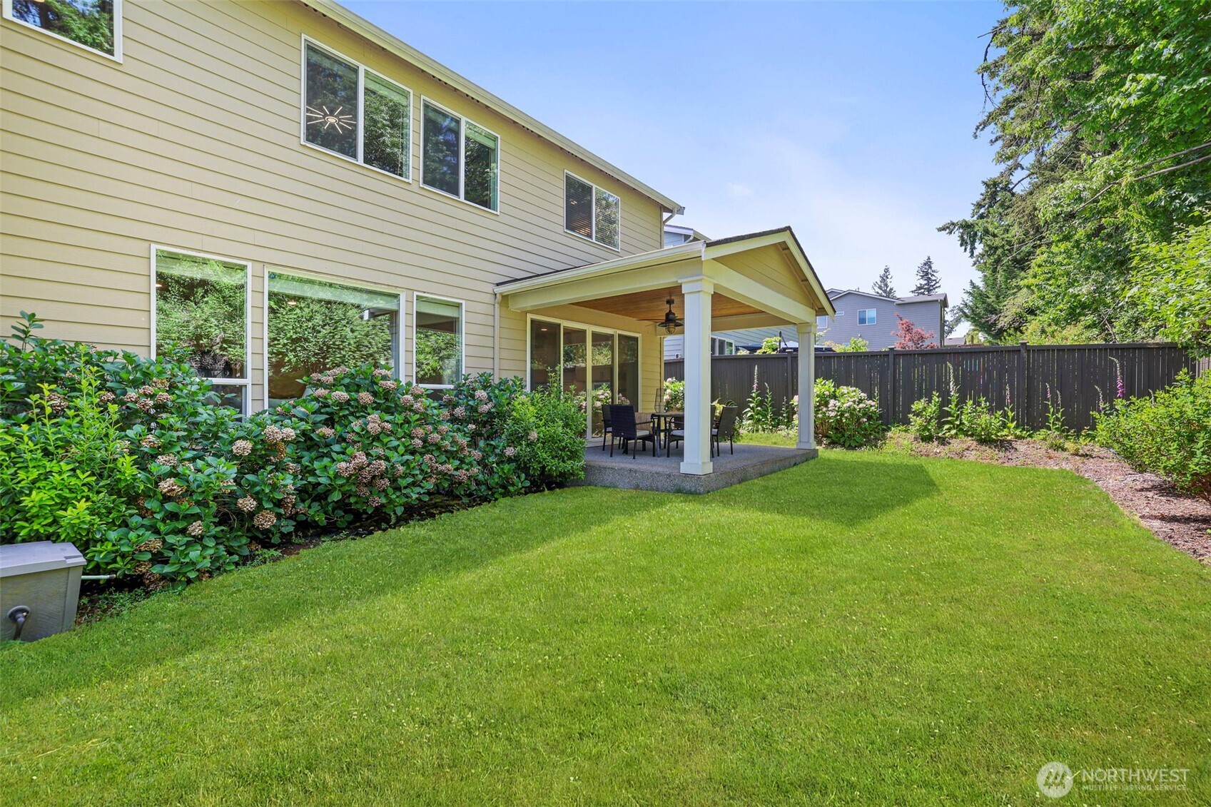 29 242nd Street Southeast Bothell, WA 98021 - Photo 33 of 40 a view of a house with a yard and sitting area