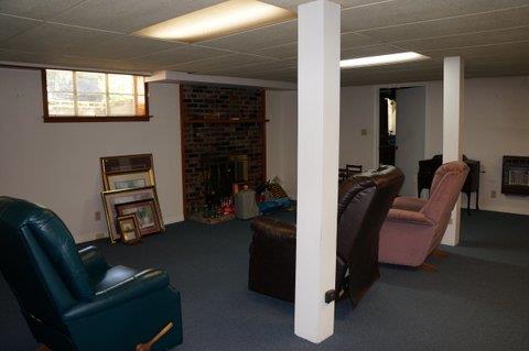 2117 Layton Road Clarksville, TN 37043 - Photo 16 of 20 23 x 24 Recreation room downstairs with a wood burning fireplace. There is also a supplemental wall heater in addition to the central heat system. Built in desk in one of the many closets. Storm shelter. Full bath. Just a very nice large space.