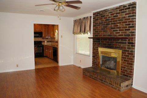 2117 Layton Road Clarksville, TN 37043 - Photo 8 of 20 Different view of the Den as your looking towards the Kitchen. Ceiling fan and access door to the large backyard.
