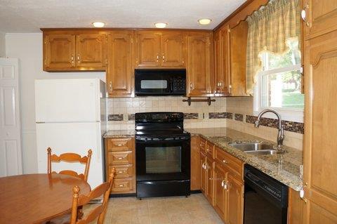 2117 Layton Road Clarksville, TN 37043 - Photo 9 of 20 Kitchen cabinets have been updated. Granite counter-top's. Pantry cabinet features pull out drawers...very nice!