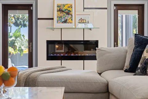 a kitchen with stainless steel appliances granite countertop a sink a stove and a wooden floors