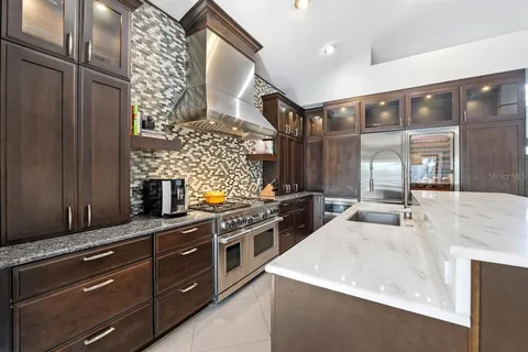 a kitchen with a stove and a microwave