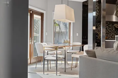 a large bathroom with a double vanity sink a large mirror and a shower