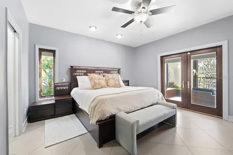 a view of a house with swimming pool and sitting area