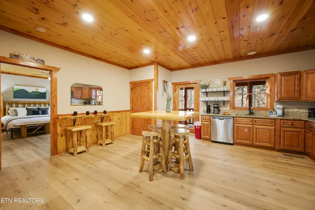 a kitchen with stainless steel appliances granite countertop a stove and a refrigerator