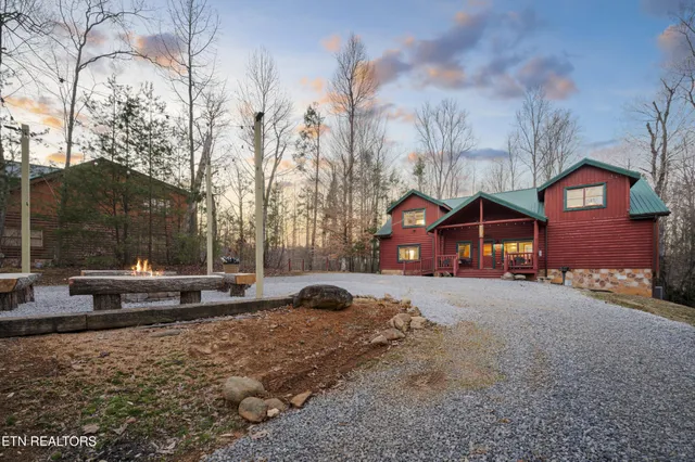 a kitchen with a stove and a wooden floor