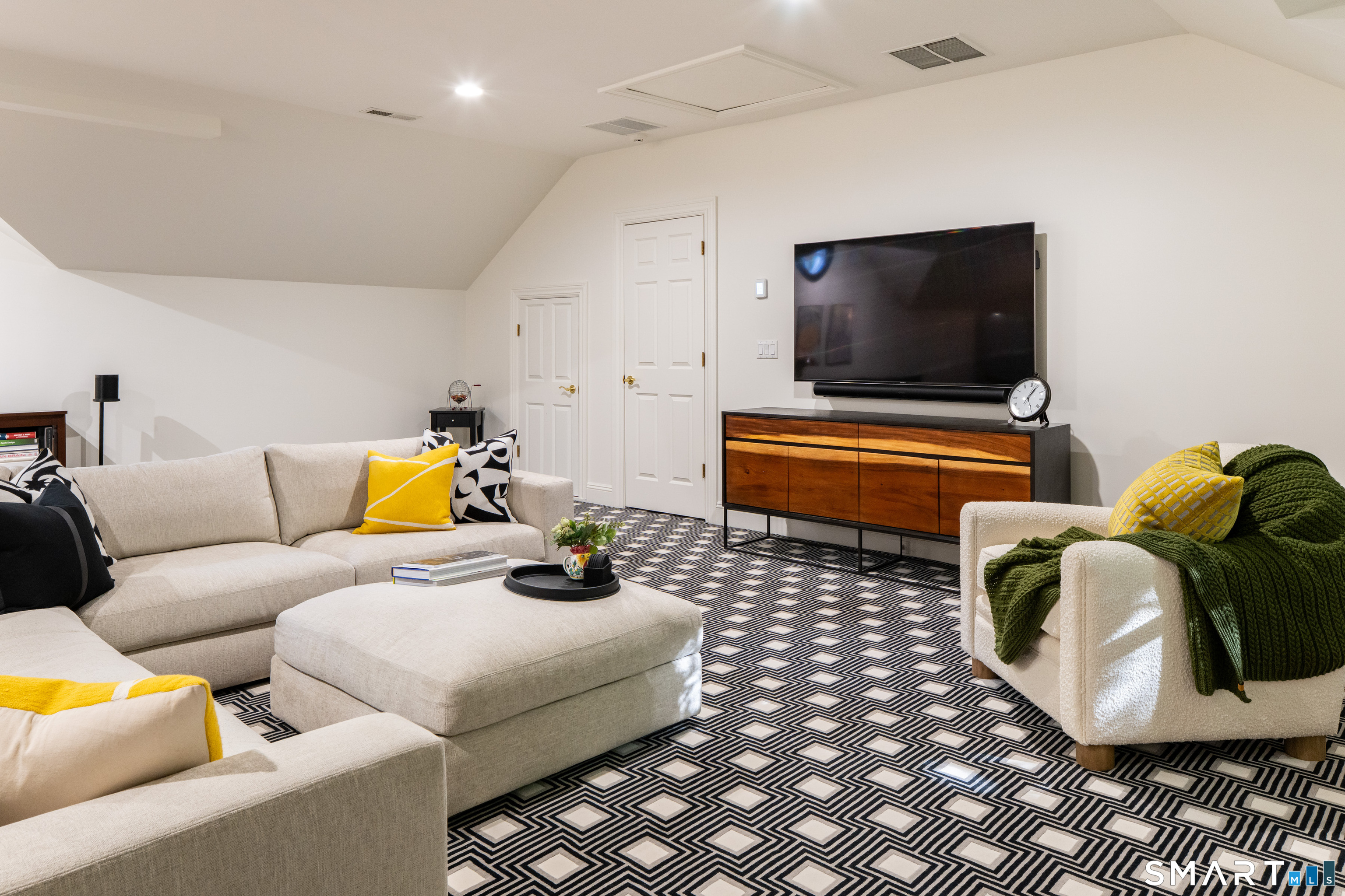 760 Smith Ridge Road New Canaan, CT 06840 - Photo 28 of 40 a living room with furniture and a flat screen tv
