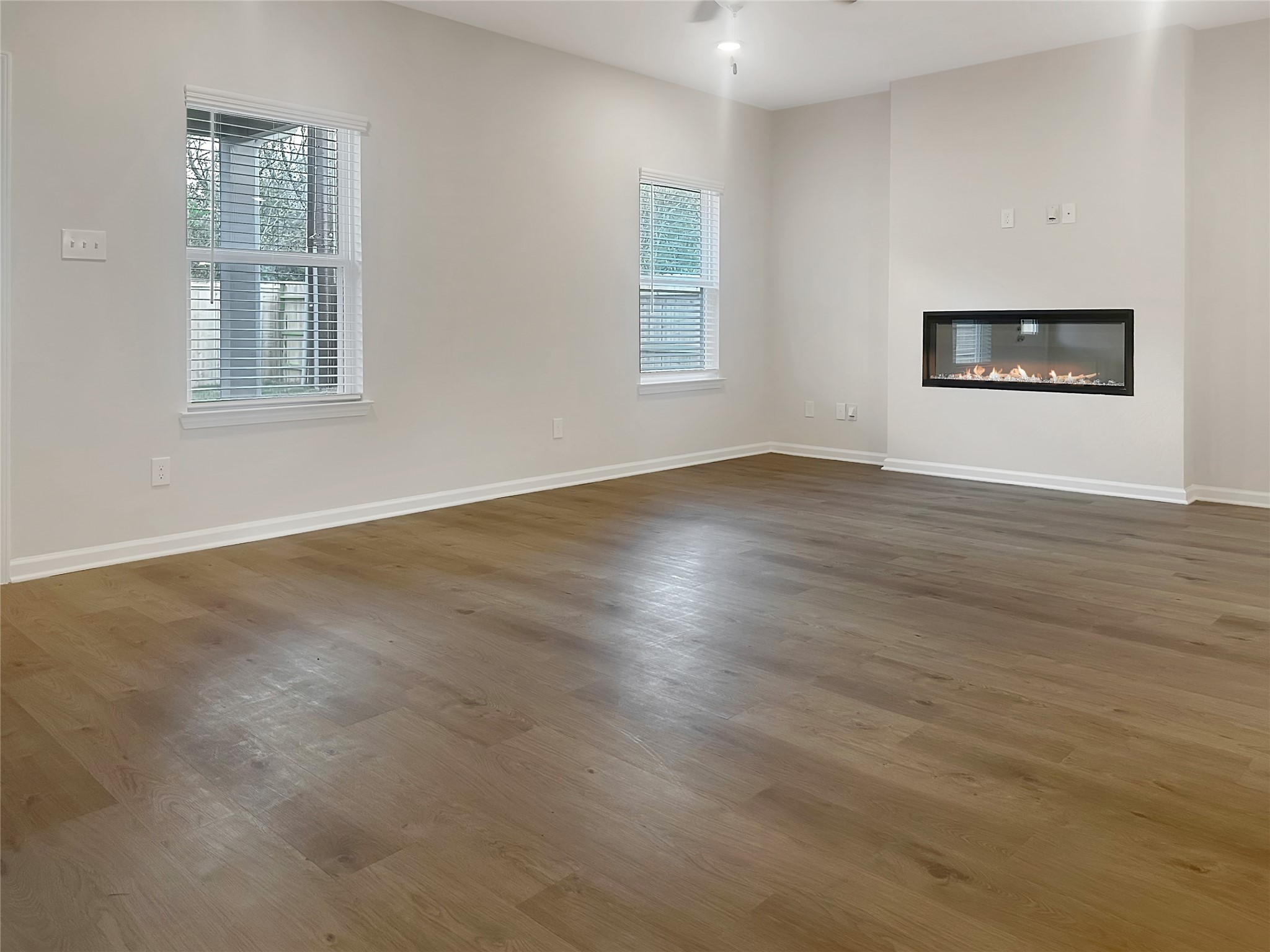 32515 Vly Redstem Way Fulshear, TX 77441 - Photo 13 of 19 The Crawford- Family Room with Linear Electric Fireplace. Home is under construction, photos used for illustration only; actual features, colors, and upgrades may vary.