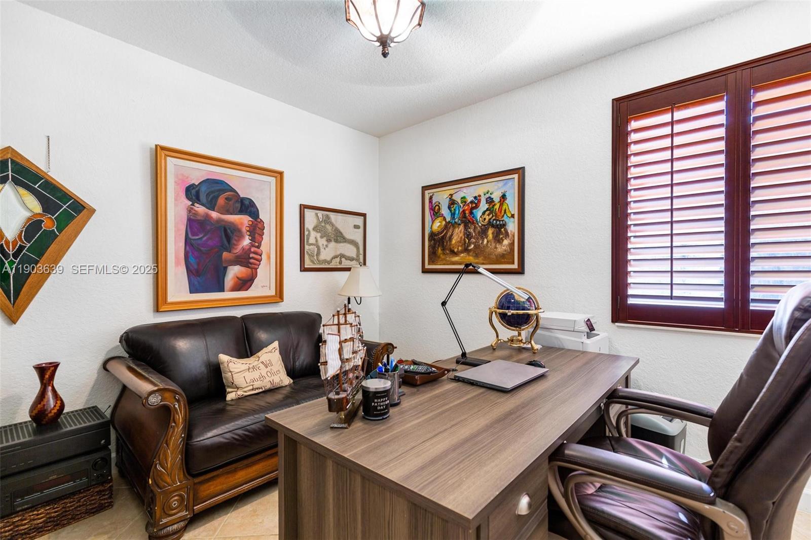 7587 Southwest 189th Street Cutler Bay, FL 33157 - Photo 23 of 66 a living room with furniture and a window