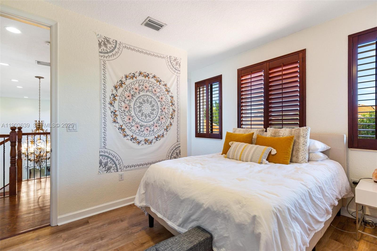 7587 Southwest 189th Street Cutler Bay, FL 33157 - Photo 29 of 66 a bedroom with a large bed and a window