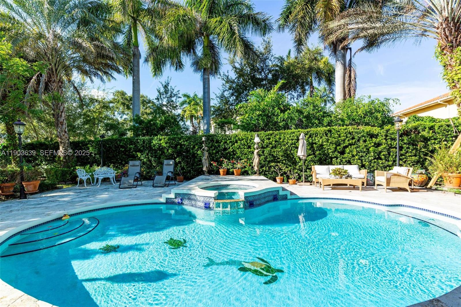 7587 Southwest 189th Street Cutler Bay, FL 33157 - Photo 3 of 66 a view of a swimming pool with a patio