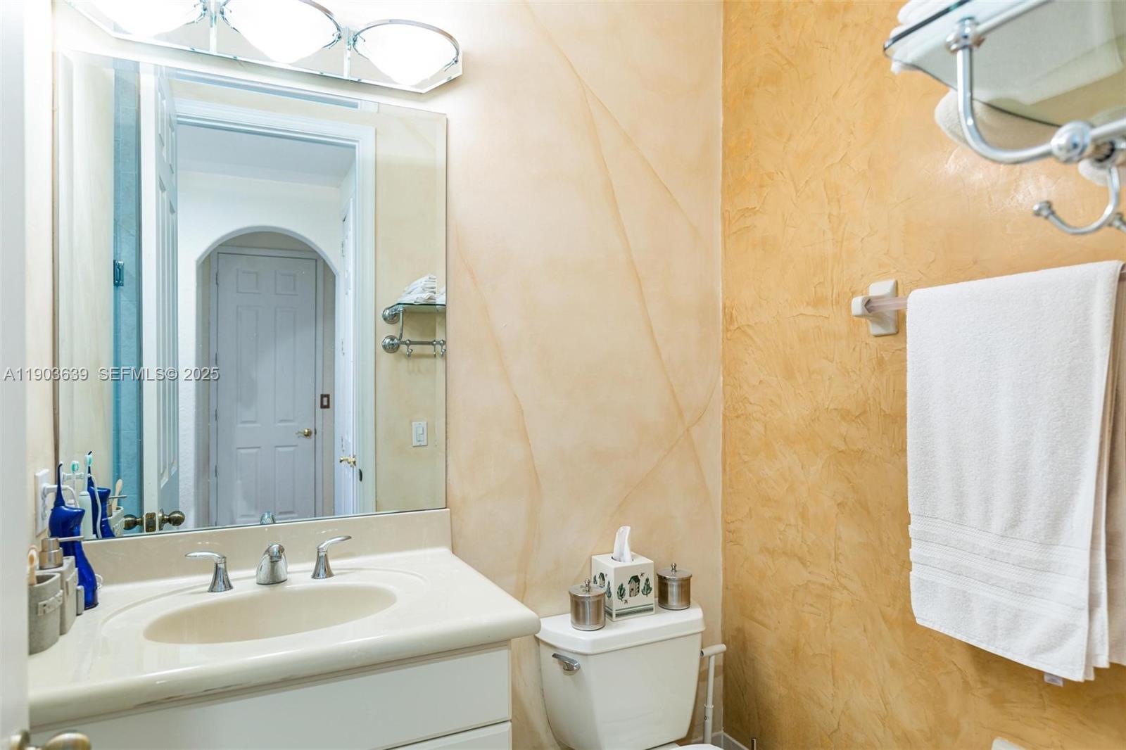 7587 Southwest 189th Street Cutler Bay, FL 33157 - Photo 44 of 66 a bathroom with a sink and a mirror