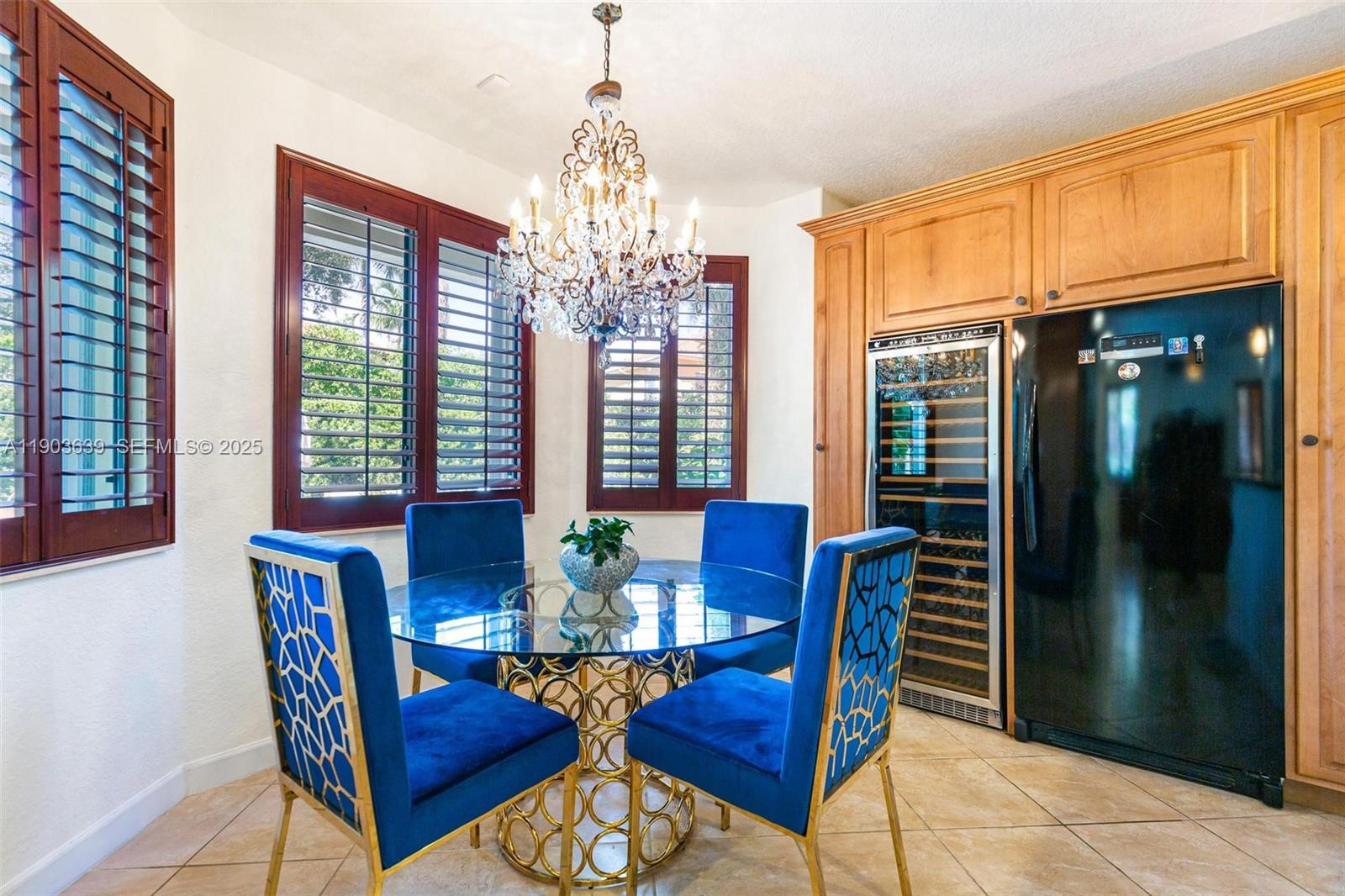 7587 Southwest 189th Street Cutler Bay, FL 33157 - Photo 5 of 66 a view of a dining room with furniture and chandelier