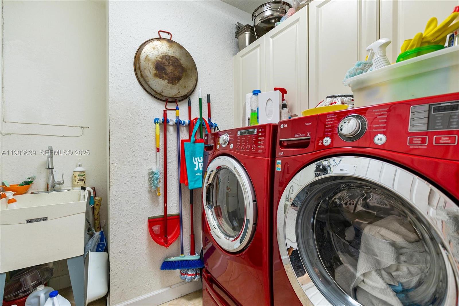 7587 Southwest 189th Street Cutler Bay, FL 33157 - Photo 51 of 66 a utility room with dryer and washer