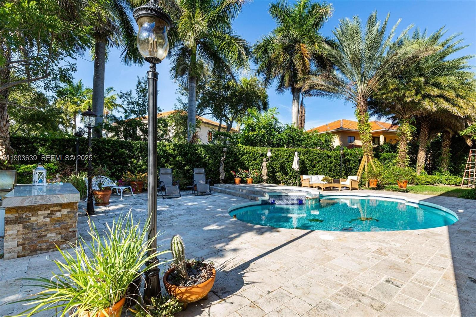 7587 Southwest 189th Street Cutler Bay, FL 33157 - Photo 52 of 66 a view of a swimming pool with a patio