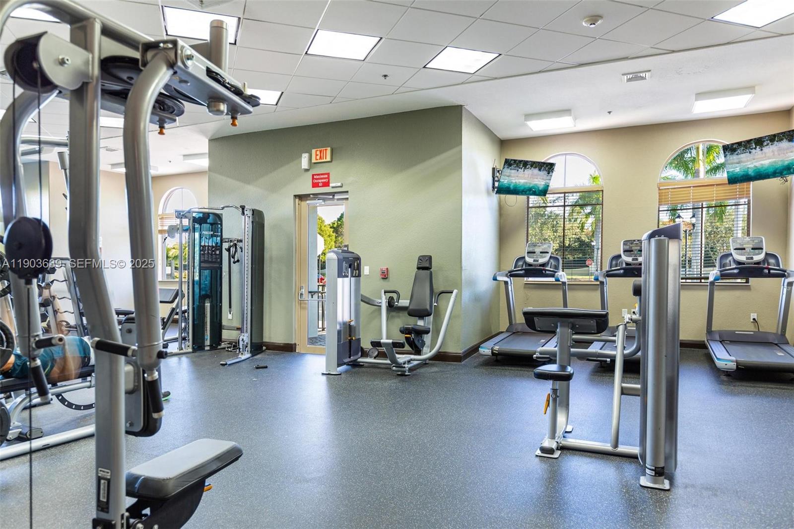 7587 Southwest 189th Street Cutler Bay, FL 33157 - Photo 63 of 66 a view of a room with gym equipment