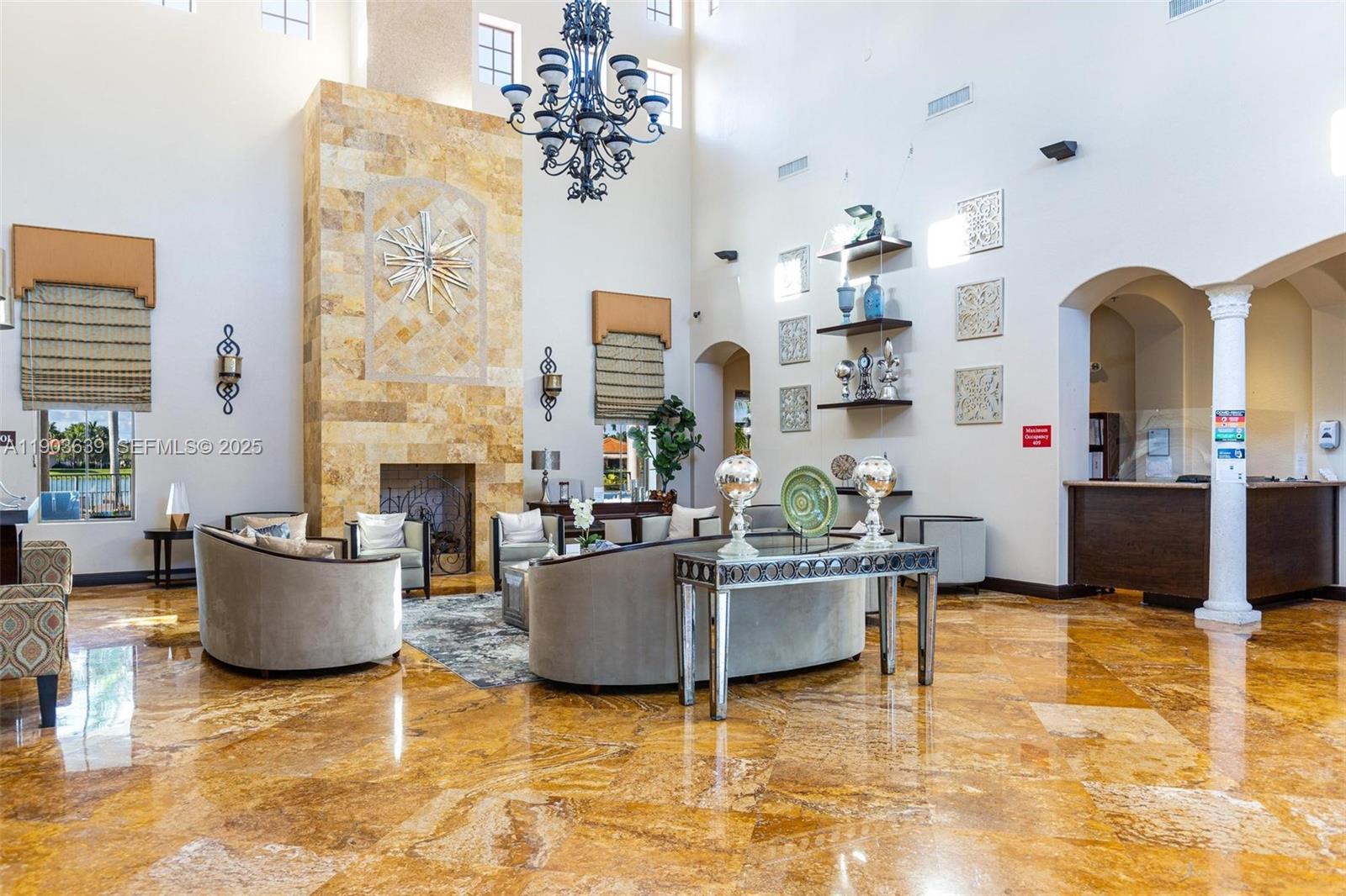 7587 Southwest 189th Street Cutler Bay, FL 33157 - Photo 66 of 66 a living room with furniture and a fireplace