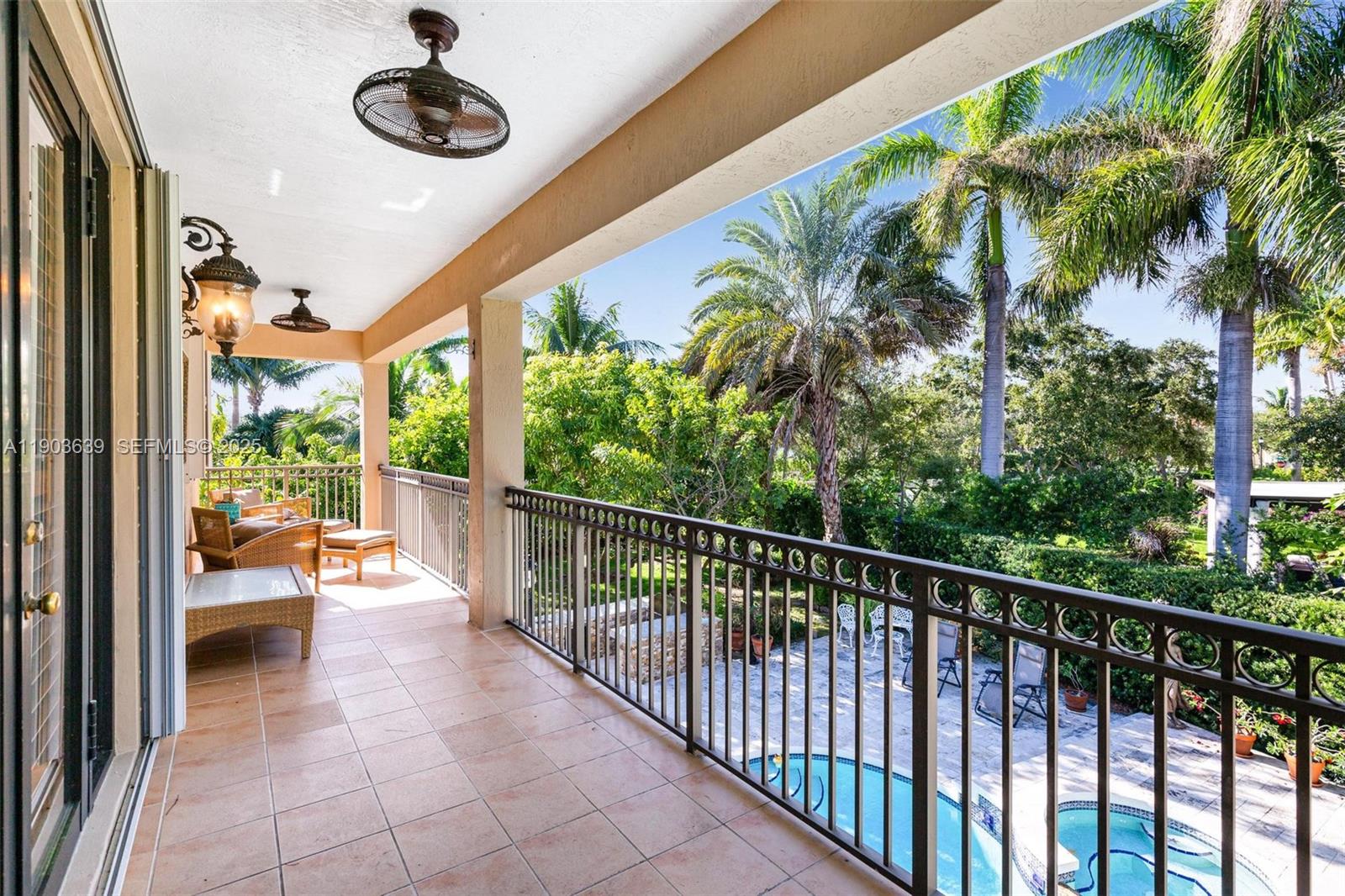 7587 Southwest 189th Street Cutler Bay, FL 33157 - Photo 8 of 66 a view of a porch with seating space