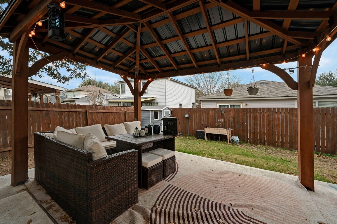 6624 Quinton Drive Austin, TX 78747 - Photo 22 of 25 a roof deck with table and chairs and a barbeque
