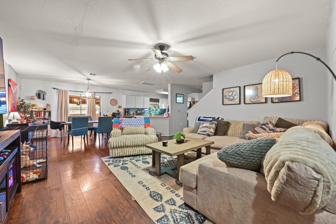 6624 Quinton Drive Austin, TX 78747 - Photo 4 of 25 a living room with furniture and wooden floor