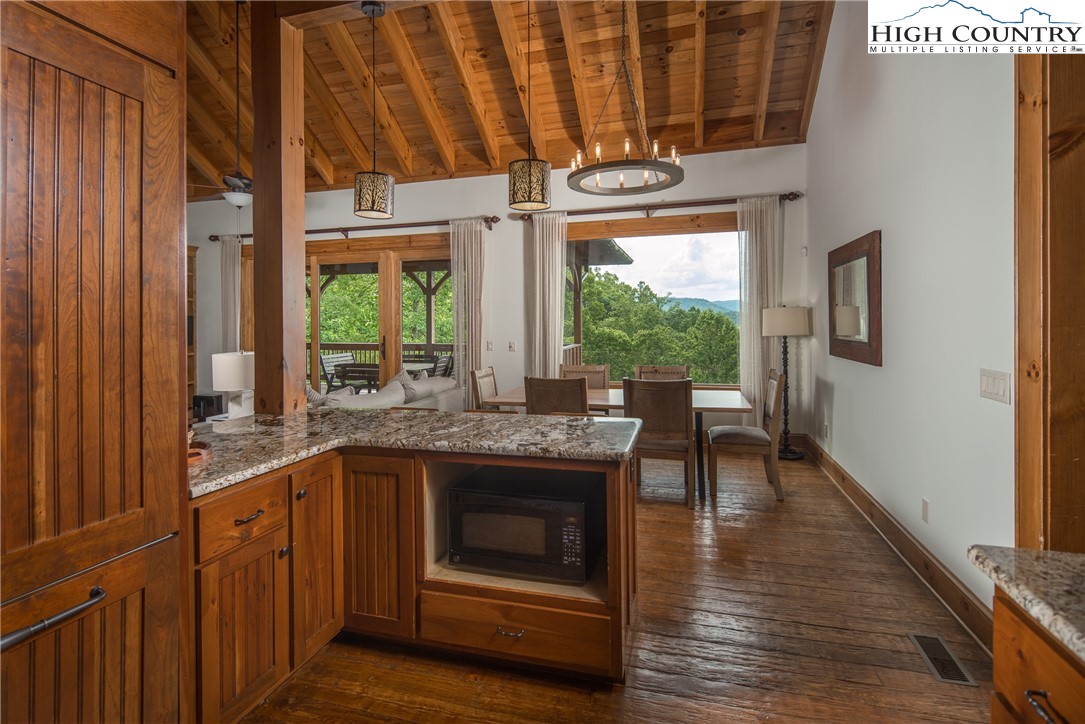 153 Stonecrop Lane Boone, NC 28607 - Photo 11 of 49 a kitchen with stainless steel appliances granite countertop a stove and a refrigerator