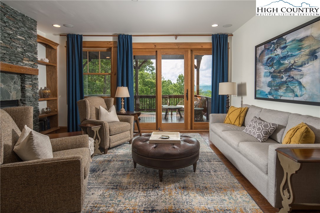 153 Stonecrop Lane Boone, NC 28607 - Photo 21 of 49 a living room with furniture and a large window