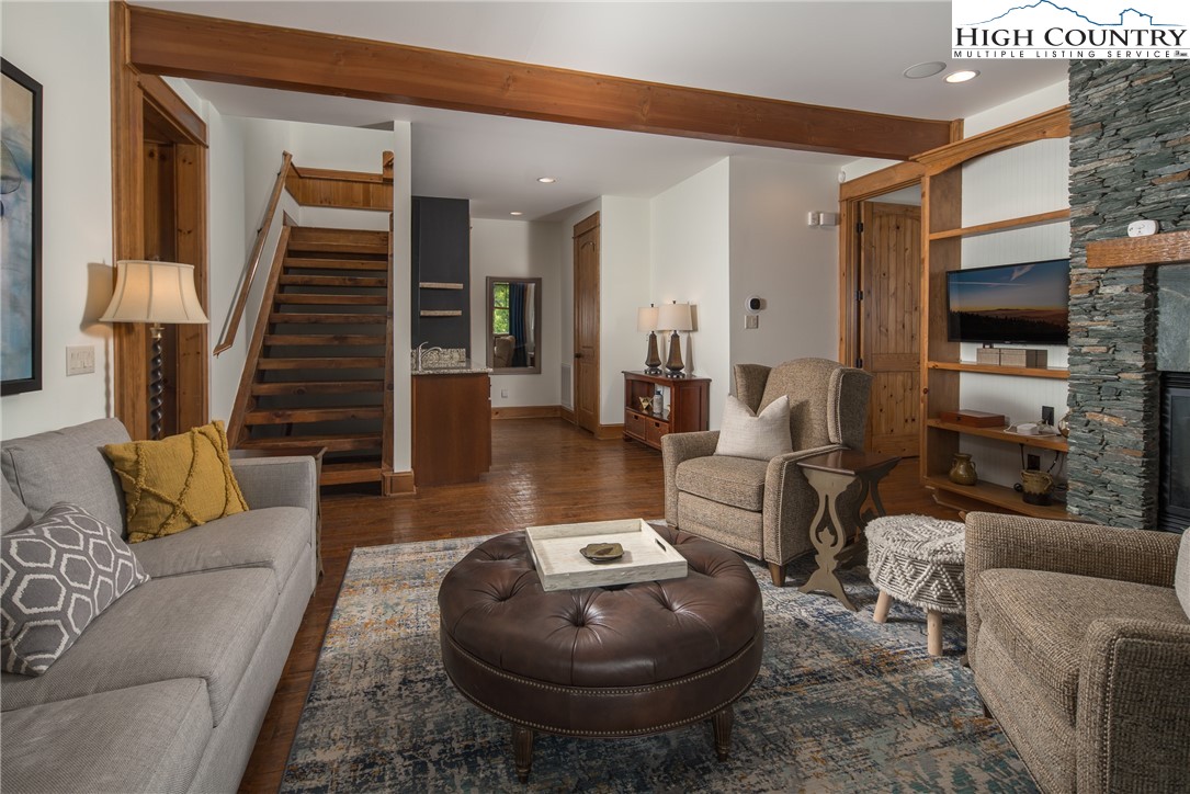 153 Stonecrop Lane Boone, NC 28607 - Photo 22 of 49 a living room with furniture and a flat screen tv
