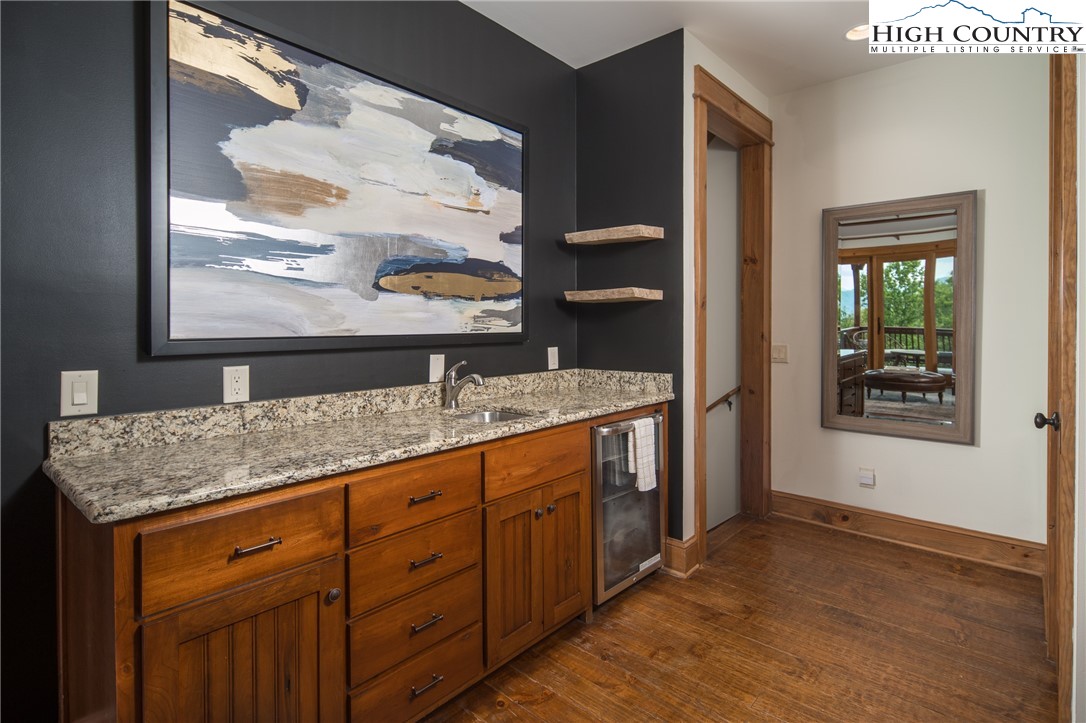153 Stonecrop Lane Boone, NC 28607 - Photo 23 of 49 a bathroom with a granite countertop sink and a window