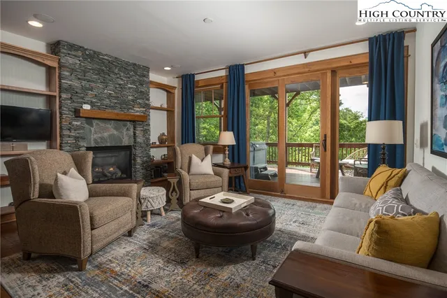 a bathroom with a granite countertop tub sink and mirror